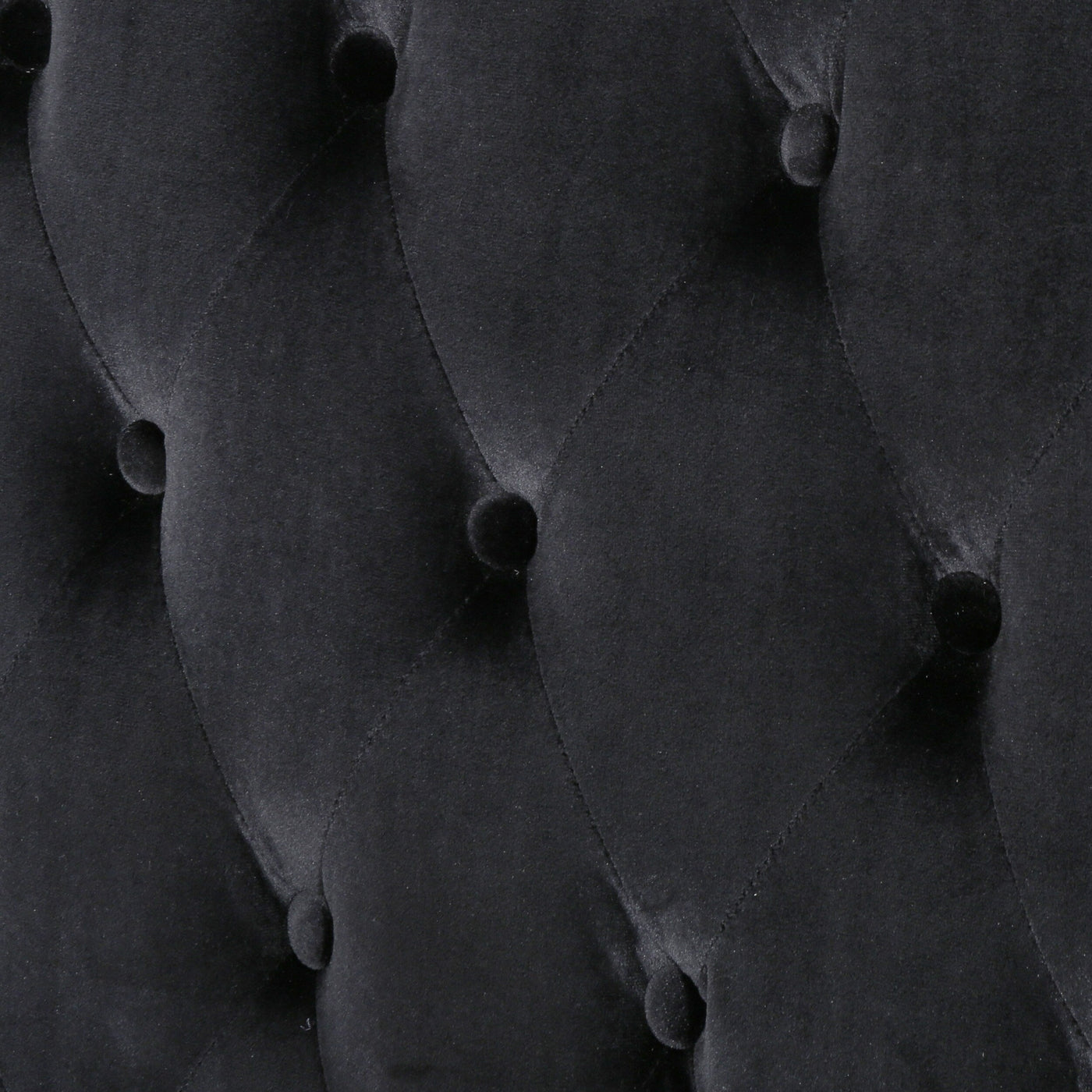 Canapé à oreilles hautes capitonné en velours noir