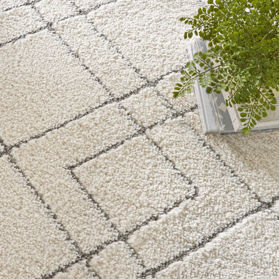 Tapis Nourison luxueux à poils longs et ultra moelleux, motif géométrique abstrait